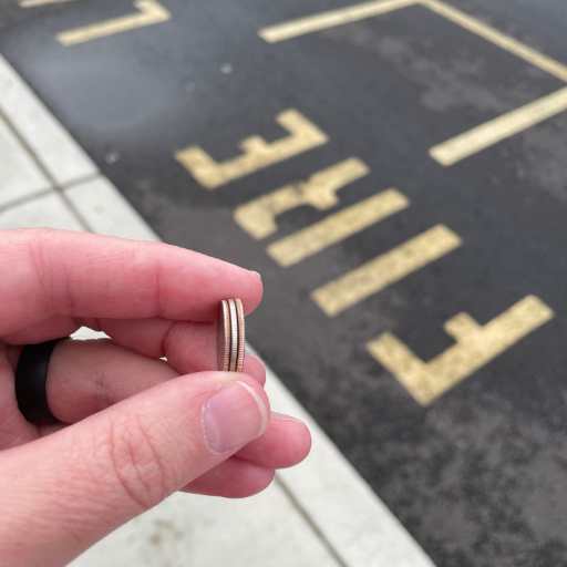 a person holding a ring with a ring on it