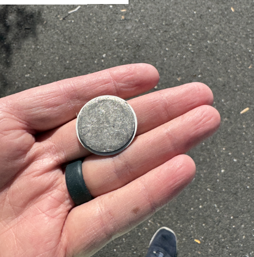 a person holding a coin with a coin