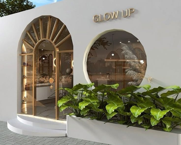 a white wall with a window and a planter