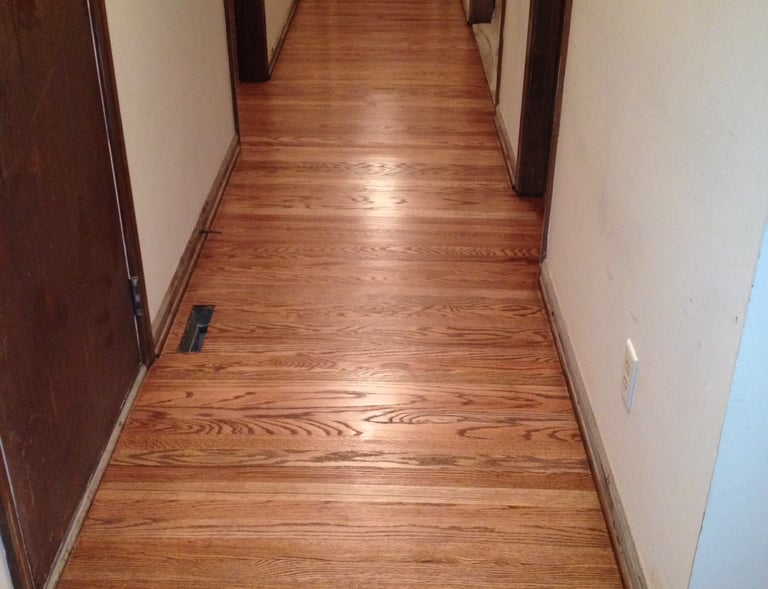 Refinished hardwood floors in hallway