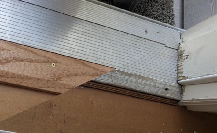 Split before and after picture of a repaired patio threshold