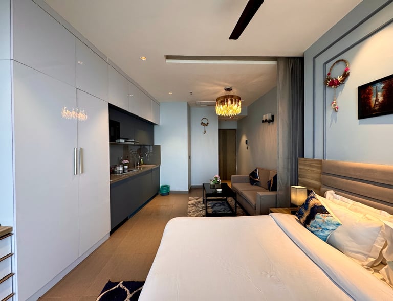 Room that has wardrobe kitchen appliancec