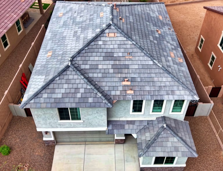 a house with a roof that has a roof that is covered in shinning