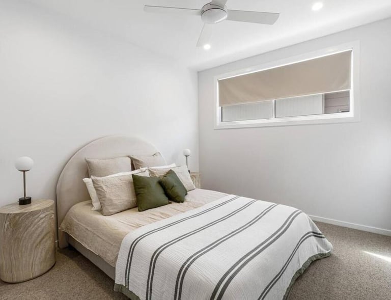 spacious master suite with queen size bed, ducted air conditioning and a ceiling fan with ensuite