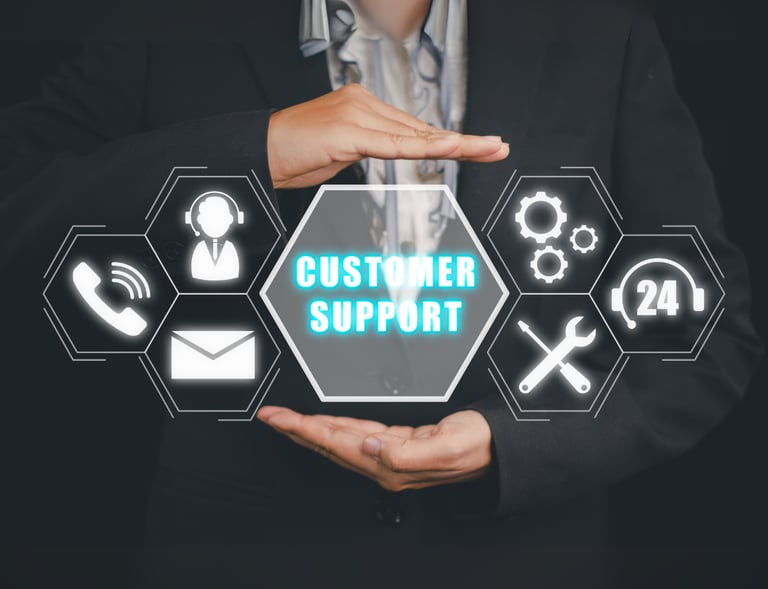Businessman holding a glowing "Customer Support" icon with phone, email, and 24/7 service icons.