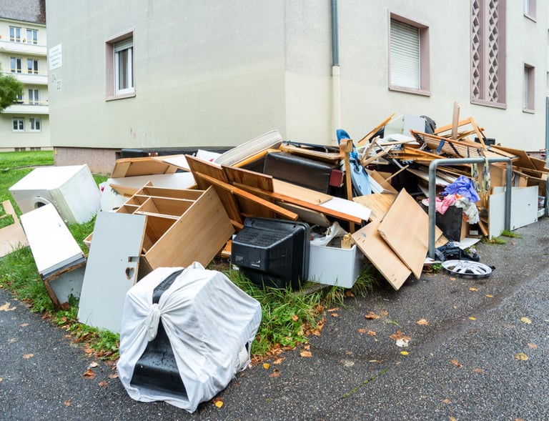 old furniture piled along driveway
