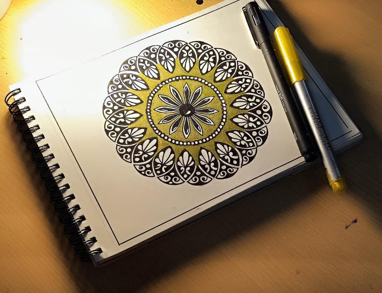a notebook with a pen and a pen on a table