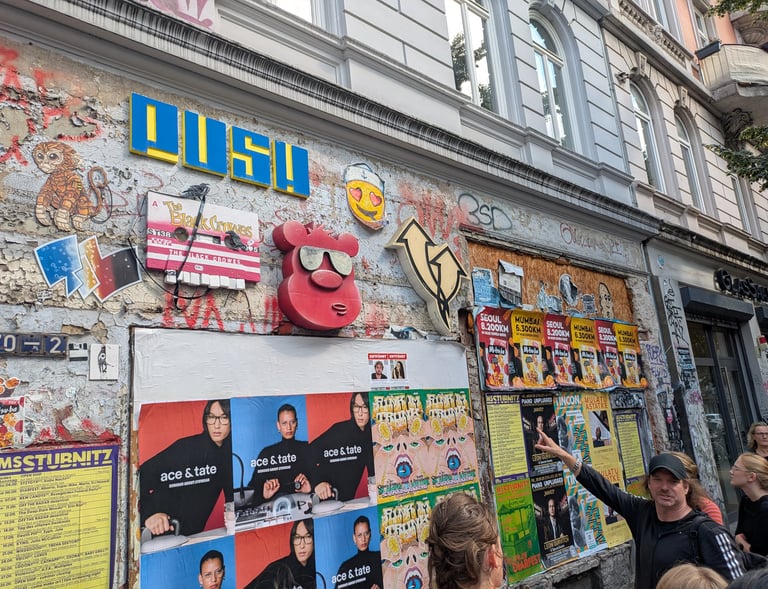 Street art tour in Hamburg with guide explaining posters and graffiti, Stadtführung mit urbaner Kunst und Szene