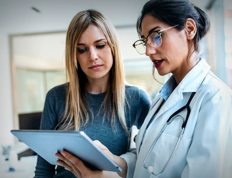 a medical sales representative visiting a doctor in a hospital and sharing treatment information