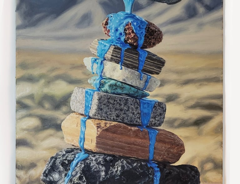 Oil painting of vibrant blue paint pouring over a balanced stack of desert stones and flat rocks.