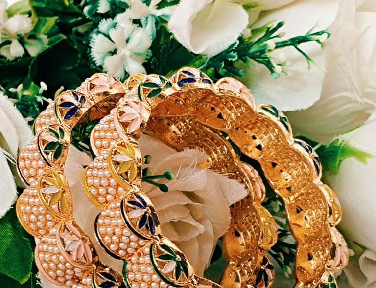 Hancrafted moti bangles set from Amira Jewels