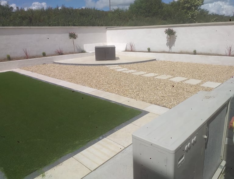 a large backyard with a lawn and a small garden