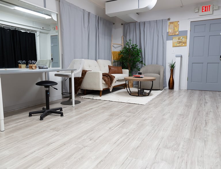 a living room with a couch and a chair