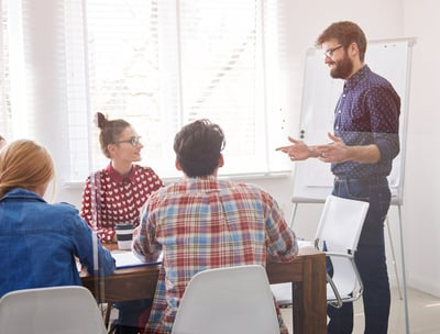 Professional Team Collaboration – A diverse team of professionals working together in an office.