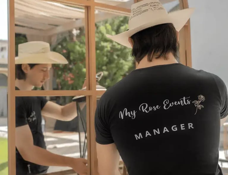 MyRose Events manager wearing a black T-shirt, arranging a table decoration.