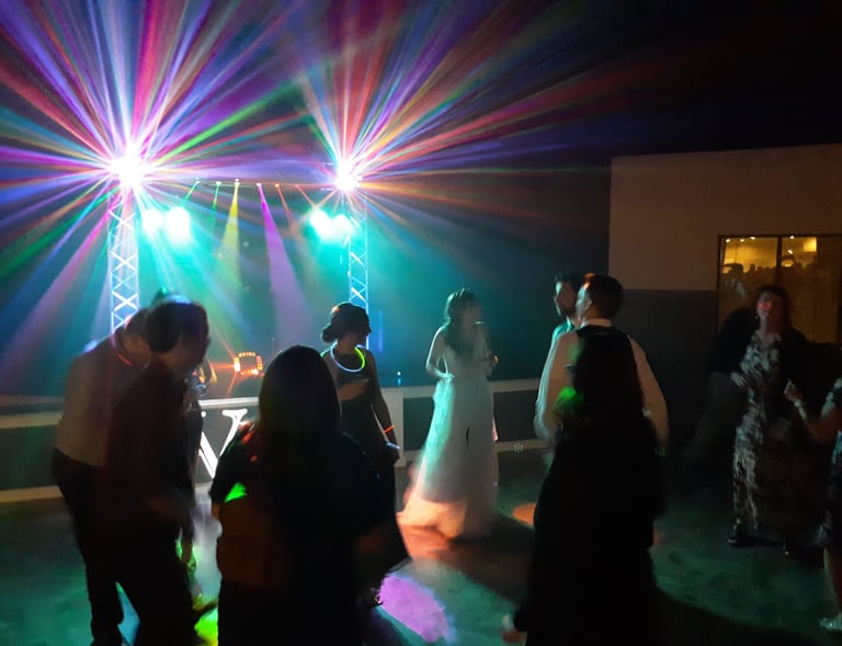 Vibrant dance lighting scene at Village at 170 in Sheboygan Falls. Wedding by Industrial Strength DJ