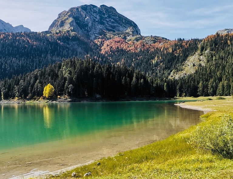 a lake with a mountain in the background