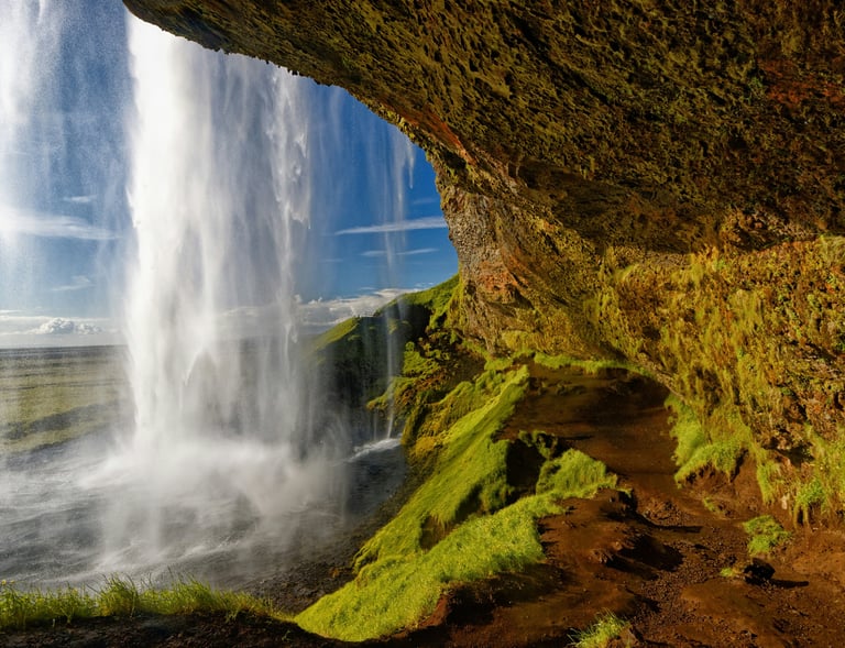 a waterfall in the middle of a cliff