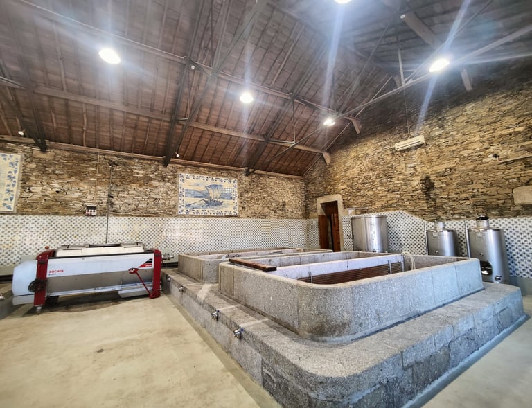 a stone wall with a stone bathtub and a stone wall