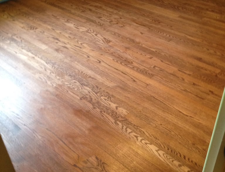 Refinished hardwood floors in bedroom