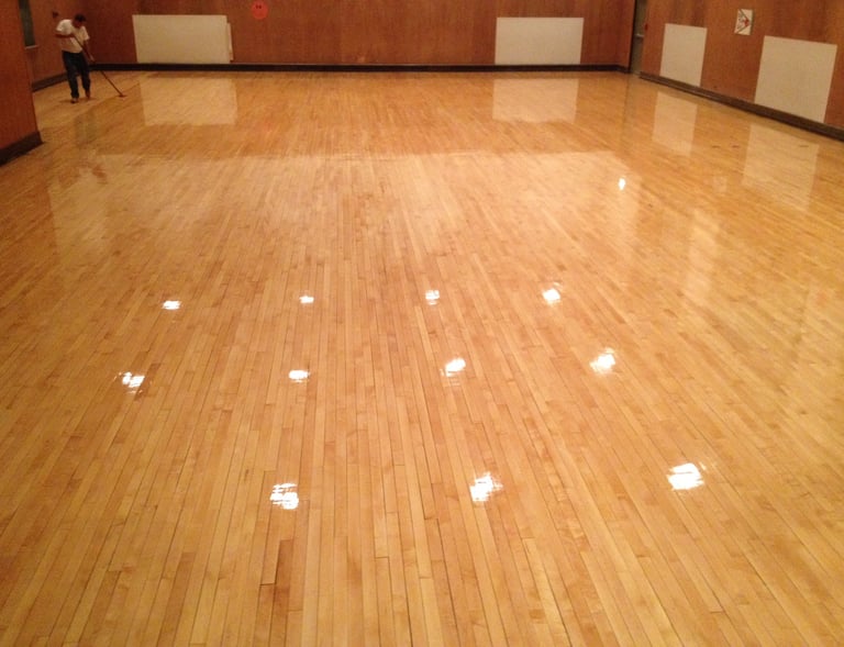 Refinished hardwood floors in gymnasium 