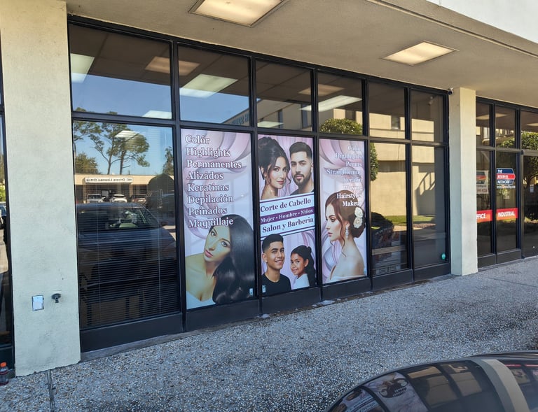a storefront door with a large window with a vinyl application perforated