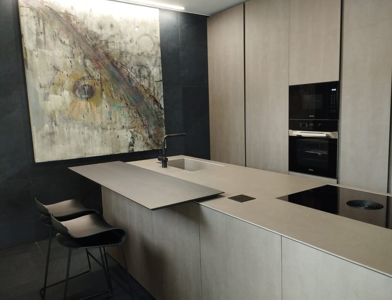 KENDE calligraphy piece with an E letter motif in a modern brown kitchen