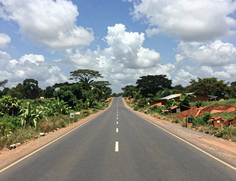 Wide shot of a newly paved road stretching through an urban infrastructure project.