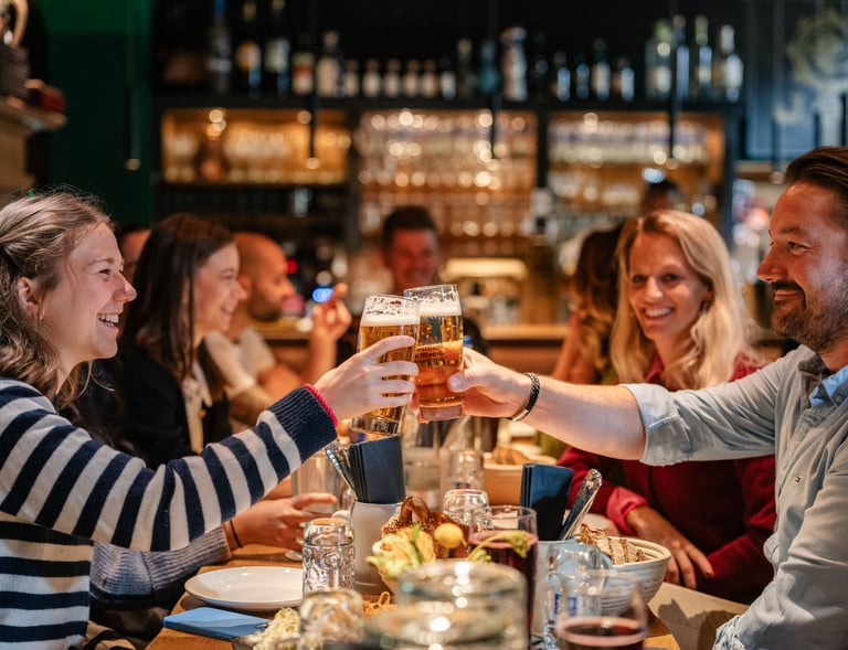 a group of people sitting at a table with drinks