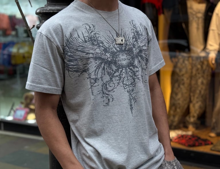 a man in a gray shirt and a white shirt
