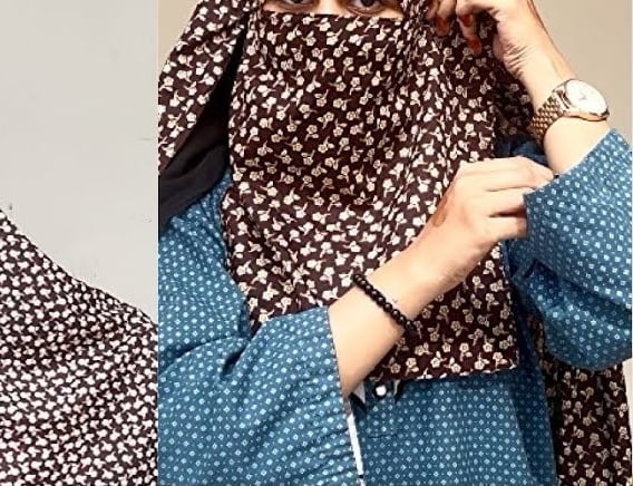 a woman wearing a brown chadar and a scarf around her neck