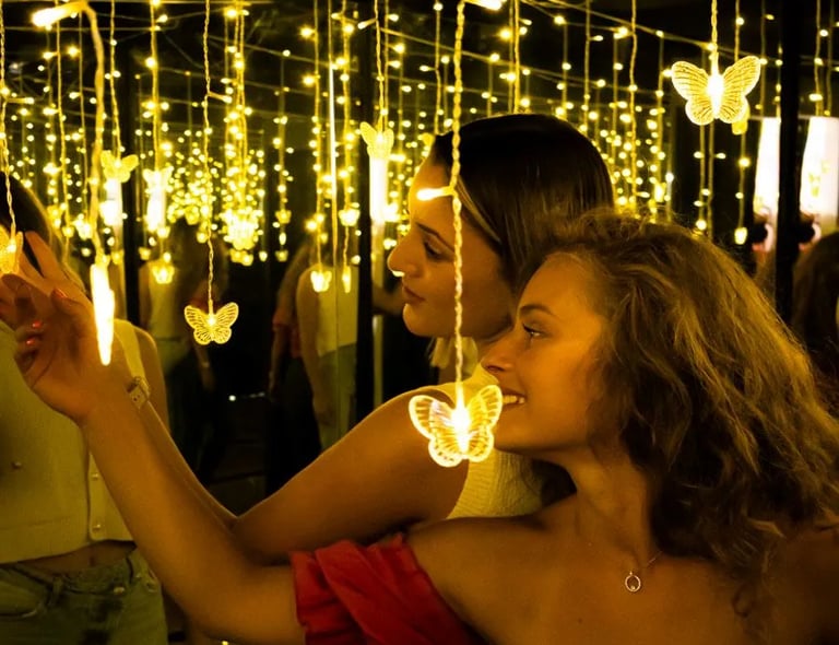 Colleagues bonding in an infinity light room during a creative corporate team building in Split.