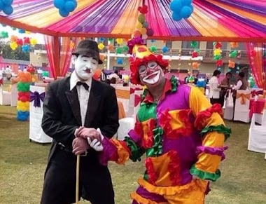 Joker For Kids Birthday Party a man in a clown mask and clown costume