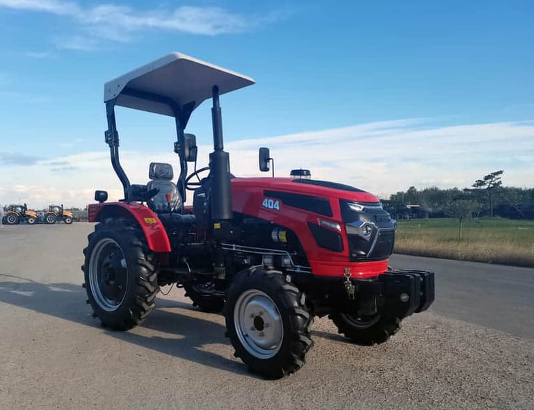 a red tractor with a canopy over it