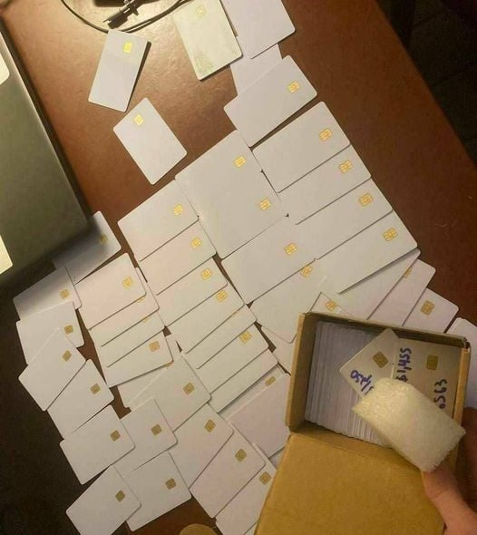 a person holding a box with a mouse mouse on it