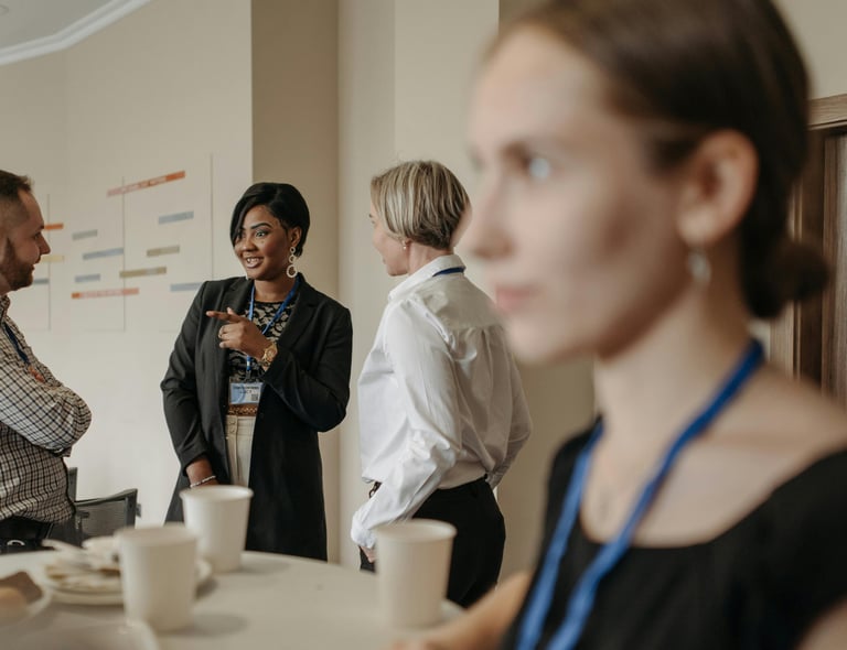 a woman in a black dress shirt and a man in a suit