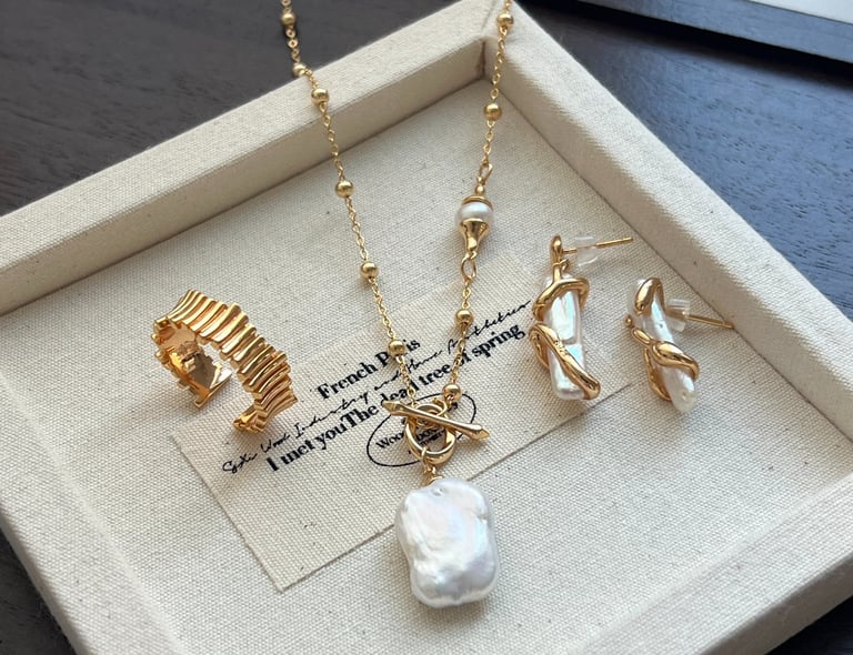 a necklace with a pearl necklace and a pearl necklace