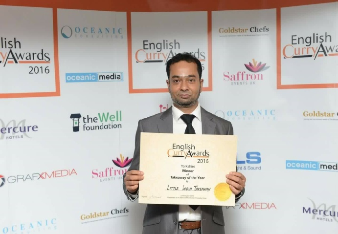 Amrad receiving winning curry award in 2016