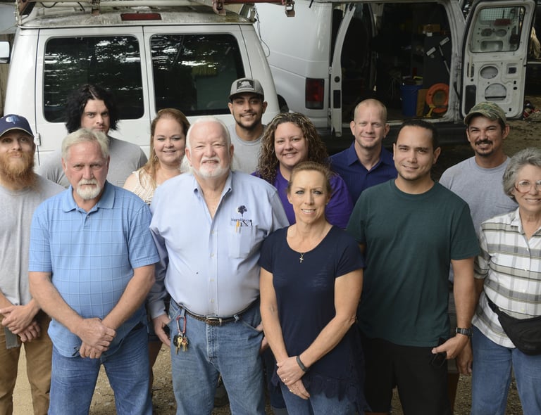 a group of people standing in front of a van