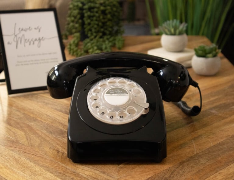 a black telephone phone with a picture of a phone
