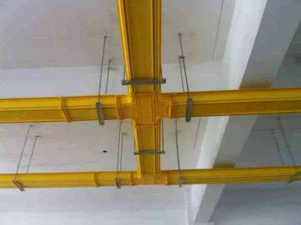 a ceiling with a yellow fiber cable tray systems