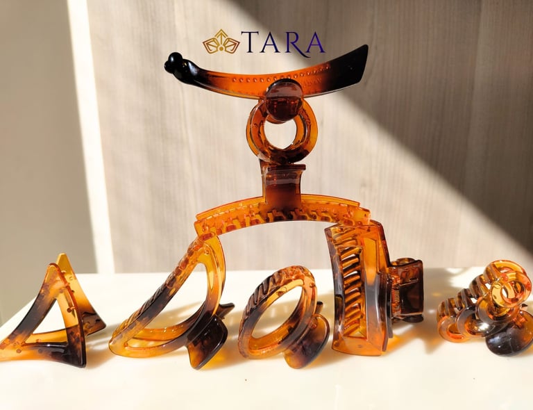 a group of hair accessories including a banan clip and a hair clip