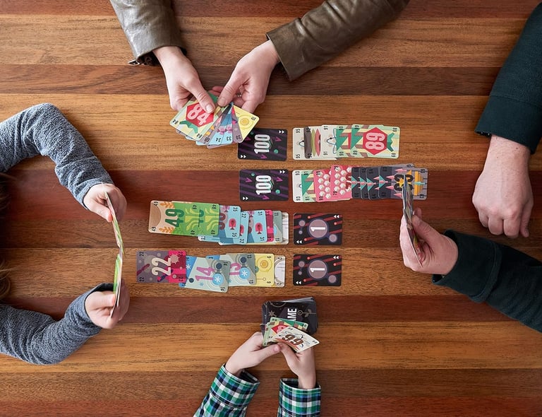 a group of people playing cards and playing cards