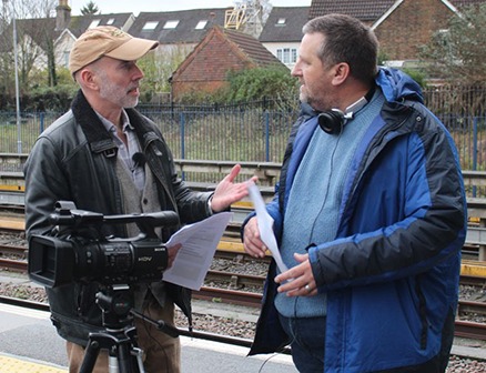 Chris Kirk and Stephen Cranford discussing a shot