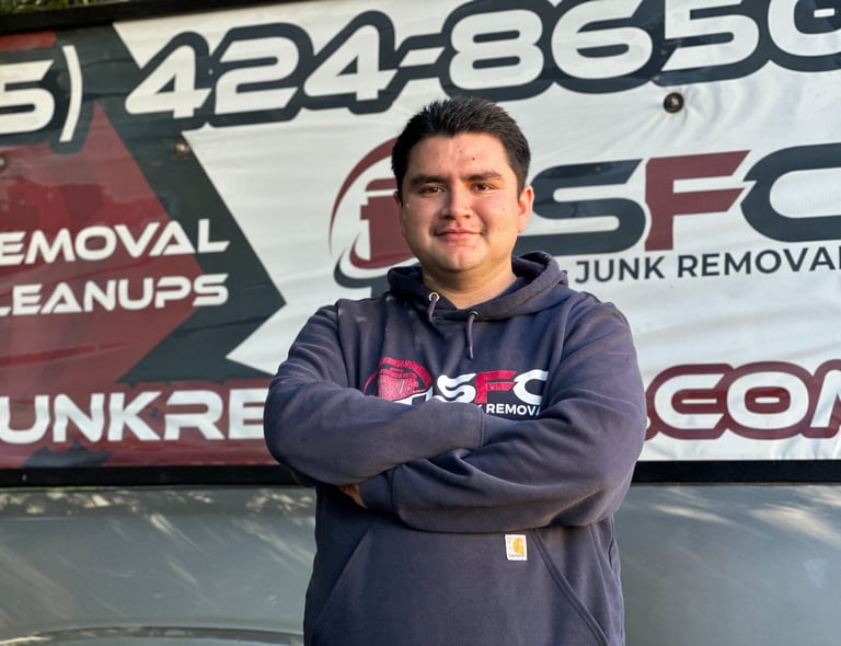 Uniformed SFC Junk Removal pro hauling attic junk in the Bay Area.