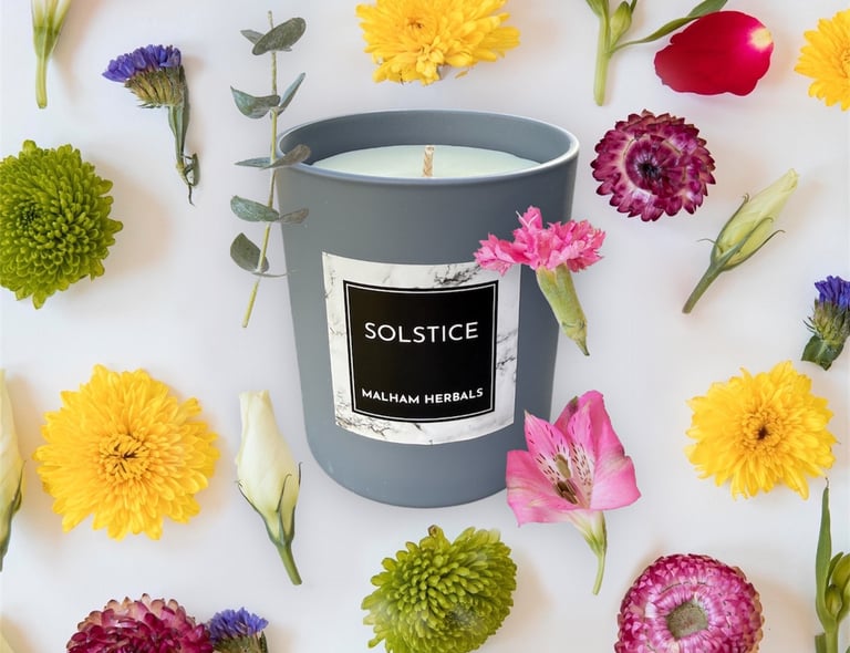 Luxury essential oil candle decorated with flowers.