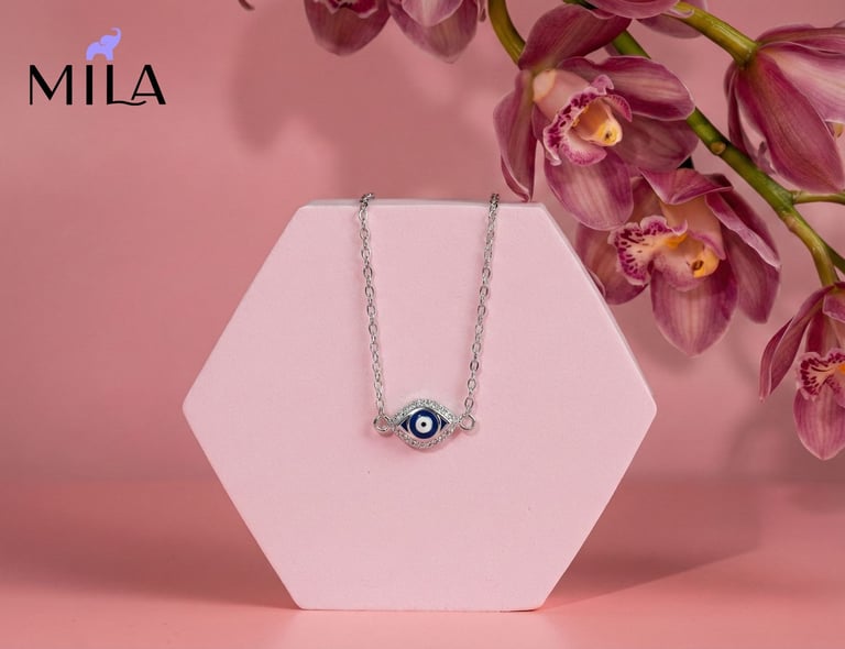 a necklace with a evil eye on it