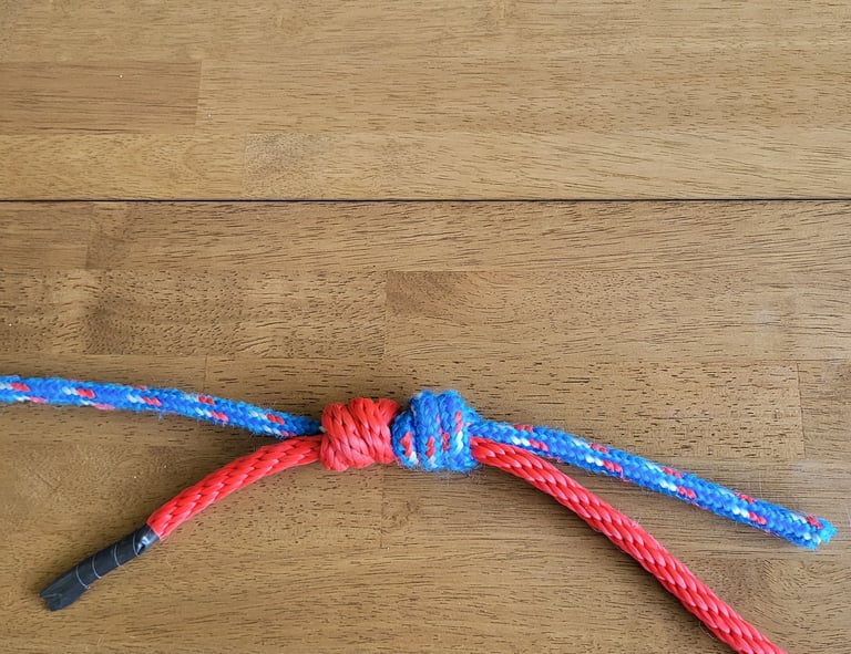 Triple Fisherman's Knot after a heavy pull, showing the junction "welded" together.