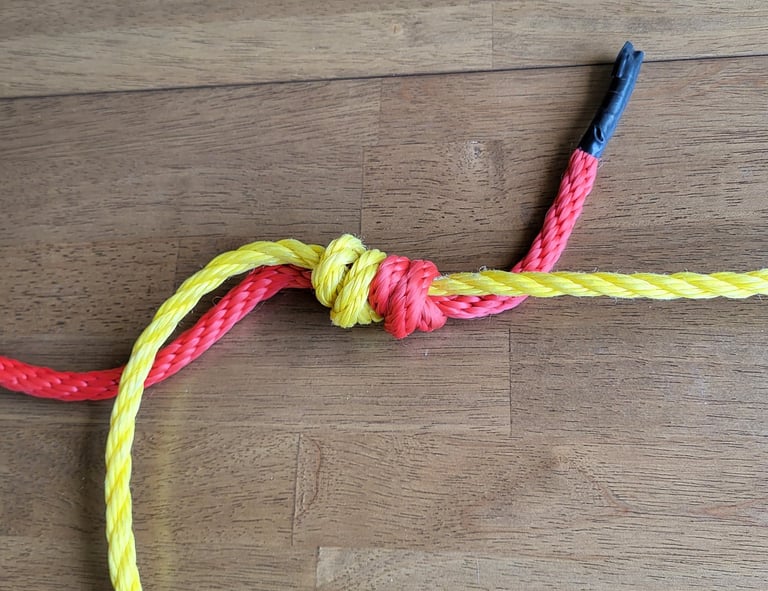 Double Fisherman's Knot with two different ropes.