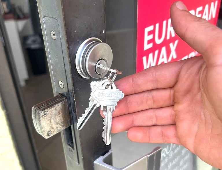 commercial locksmith repairing and rekeying a business door lock in Flagler County